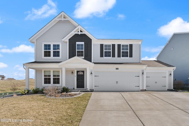 view of front of home featuring a garage, a front lawn, and driveway