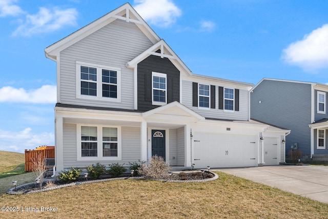 view of front facade with a front lawn, fence, a garage, and driveway