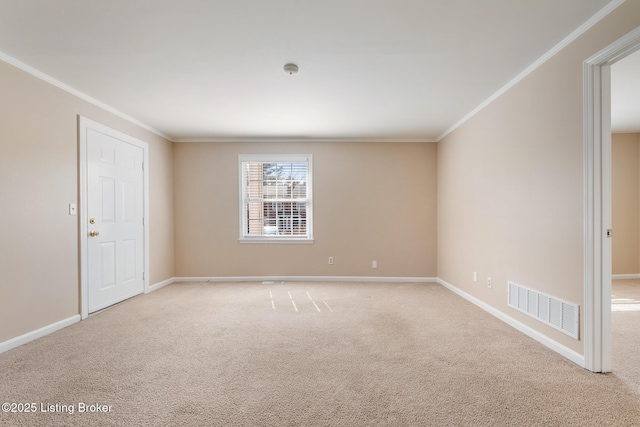 unfurnished room featuring visible vents, carpet floors, baseboards, and ornamental molding