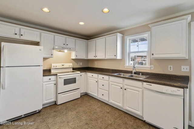 kitchen featuring white appliances, a sink, under cabinet range hood, white cabinetry, and dark countertops