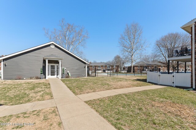 view of yard with fence and a gate