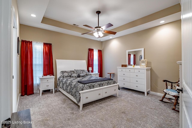 bedroom featuring baseboards, visible vents, recessed lighting, a raised ceiling, and carpet flooring