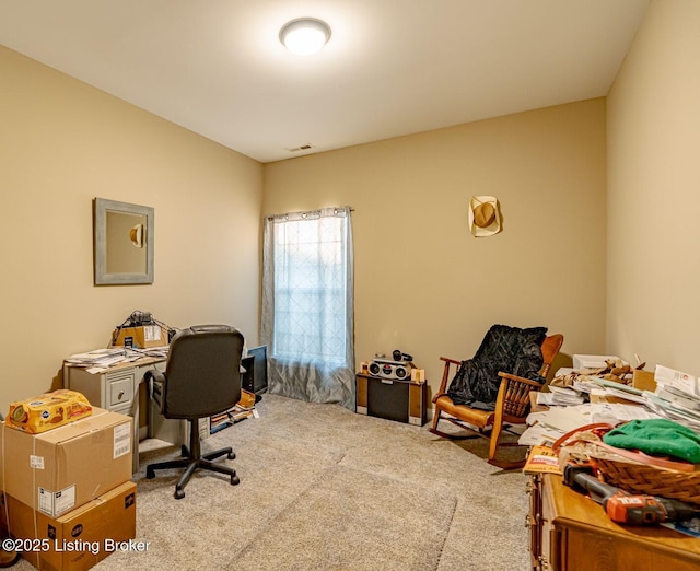 office area featuring visible vents and carpet floors