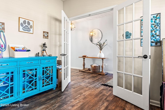 hallway with wood finished floors, french doors, and baseboards