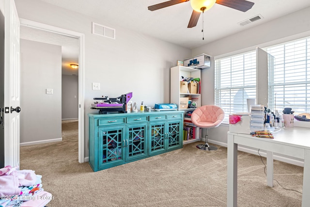 office featuring visible vents, baseboards, carpet, and a ceiling fan