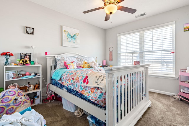 carpeted bedroom featuring baseboards, visible vents, and ceiling fan