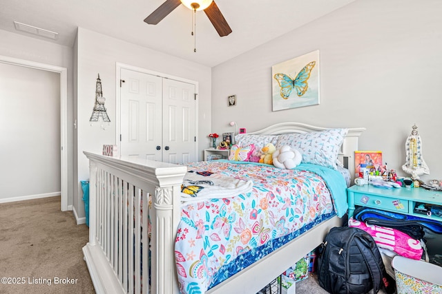 bedroom featuring carpet, visible vents, baseboards, ceiling fan, and a closet