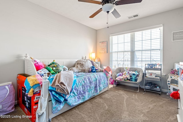 carpeted bedroom with visible vents and ceiling fan