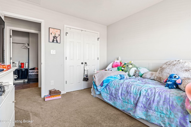 bedroom with carpet and a closet