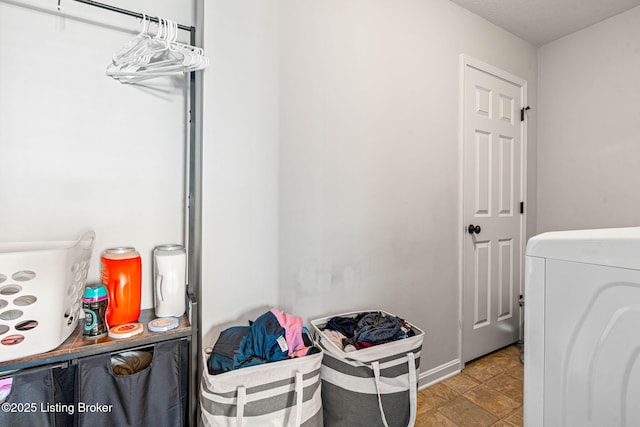 washroom featuring washer / clothes dryer and laundry area