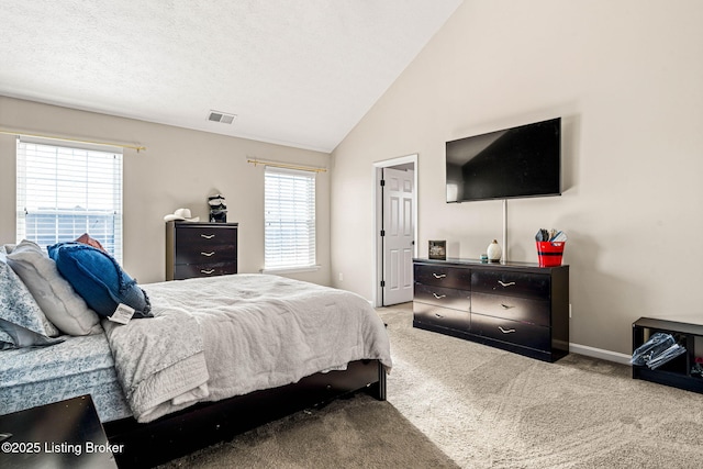 carpeted bedroom featuring visible vents, multiple windows, baseboards, and vaulted ceiling