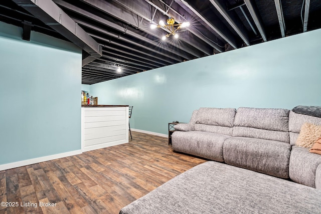 living room with baseboards and wood finished floors