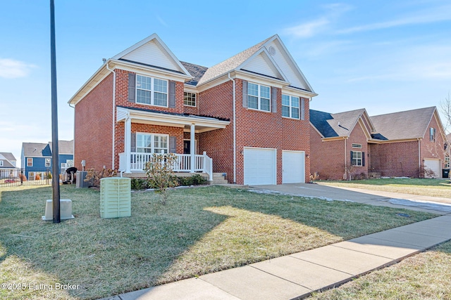 traditional home with a front yard, a porch, an attached garage, concrete driveway, and brick siding