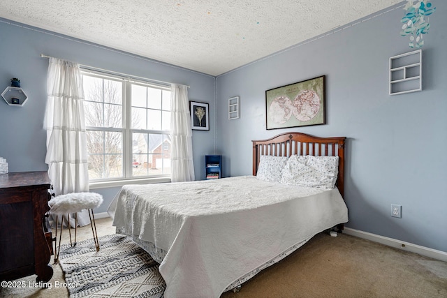 carpeted bedroom with baseboards and a textured ceiling