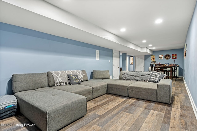 living area with recessed lighting, baseboards, and hardwood / wood-style floors