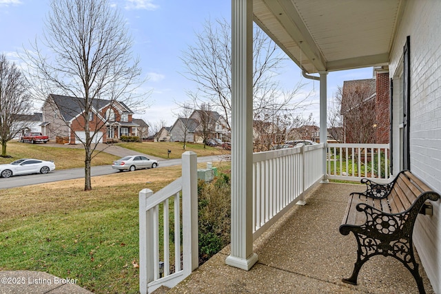 balcony featuring a residential view and covered porch