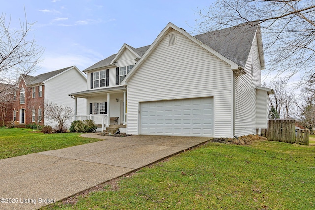 traditional-style house featuring a porch, concrete driveway, a front yard, and an attached garage