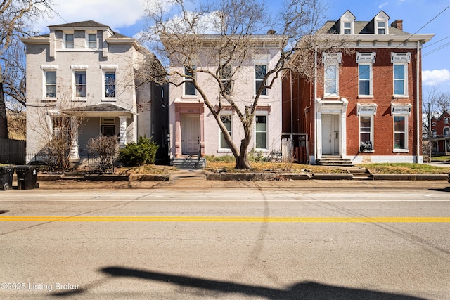 view of front facade featuring brick siding