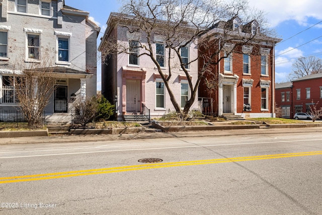 view of property with brick siding