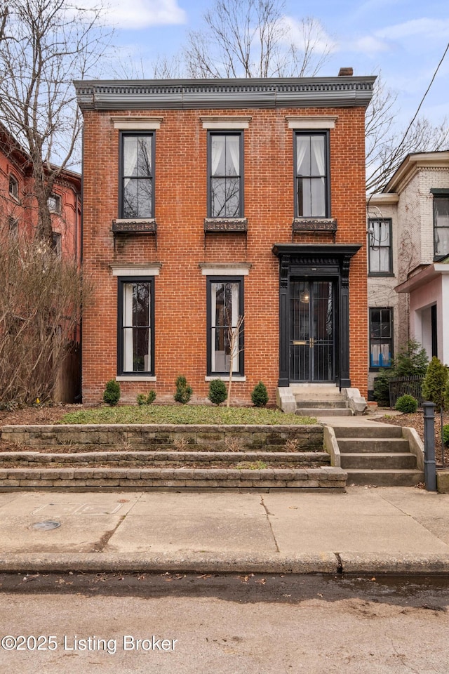 view of front of house with brick siding