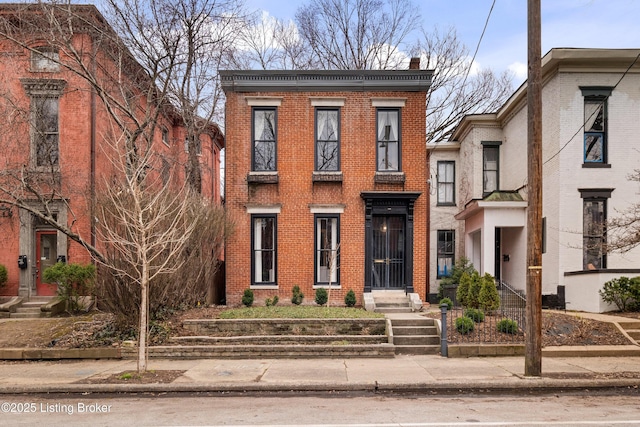 view of front of home featuring brick siding