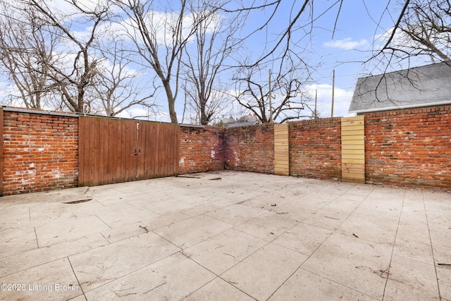 view of patio featuring fence