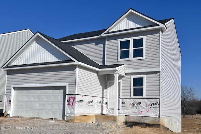 view of front of house with board and batten siding and a garage