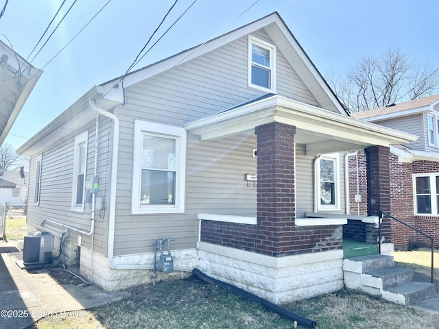 view of side of home featuring central AC