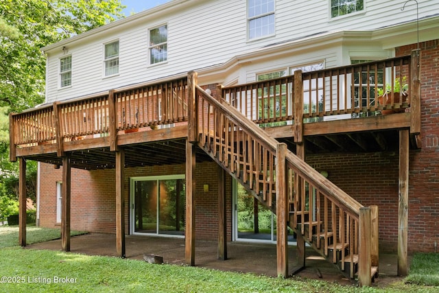 602 Club Ln, Louisville, KY 40207 - rear view of property with a deck, brick siding, and a patio area