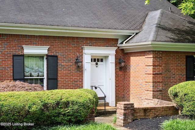602 Club Ln, Louisville, KY 40207 - view of exterior entry featuring roof with shingles and brick siding