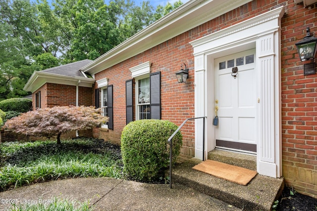 602 Club Ln, Louisville, KY 40207 - view of exterior entry with brick siding and roof with shingles