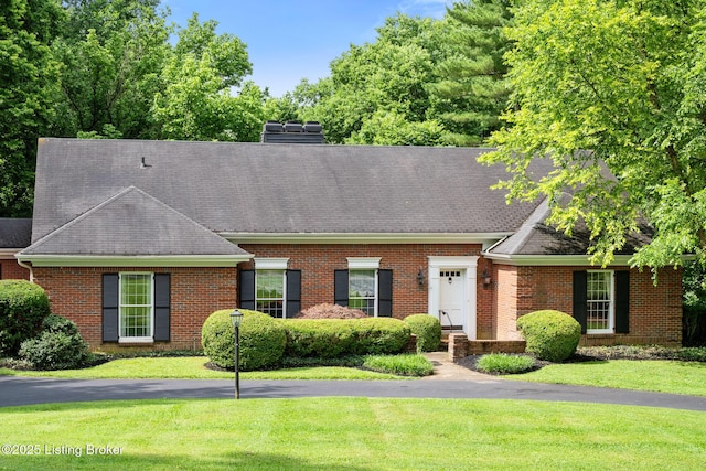 602 Club Ln, Louisville, KY 40207 - view of front of home featuring a front lawn, brick siding, a shingled roof, and a chimney
