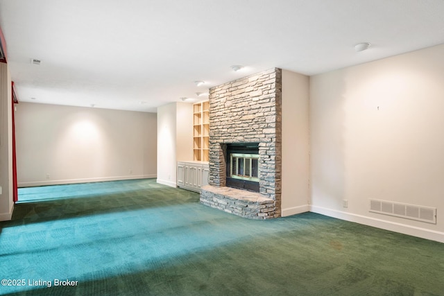 602 Club Ln, Louisville, KY 40207 - unfurnished living room featuring carpet, built in features, and a stone fireplace