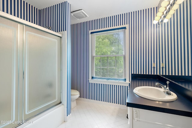 602 Club Ln, Louisville, KY 40207 - bathroom with wallpapered walls, tile patterned flooring, vanity, and bathtub / shower combination