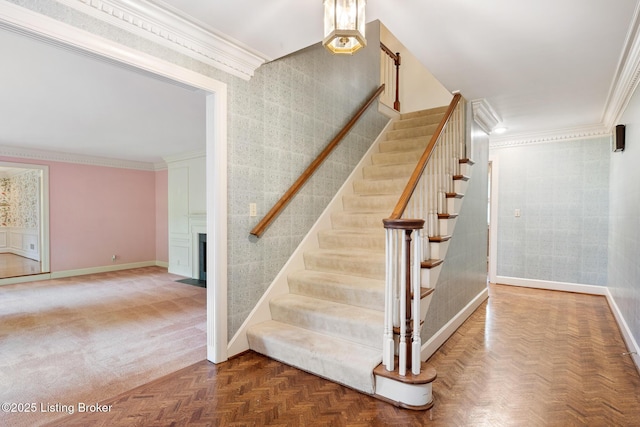 602 Club Ln, Louisville, KY 40207 - staircase featuring ornamental molding and a large fireplace