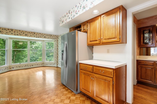 602 Club Ln, Louisville, KY 40207 - kitchen featuring light countertops, stainless steel fridge with ice dispenser, and brown cabinets