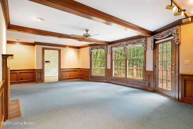602 Club Ln, Louisville, KY 40207 - carpeted spare room featuring a wainscoted wall, crown molding, a ceiling fan, and a decorative wall