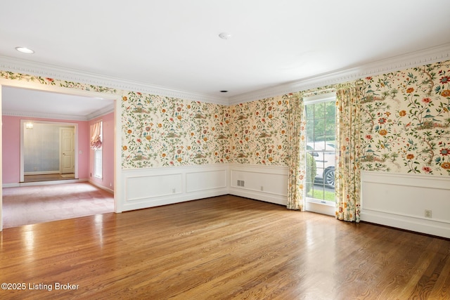 602 Club Ln, Louisville, KY 40207 - spare room featuring crown molding, wallpapered walls, a wainscoted wall, and wood finished floors