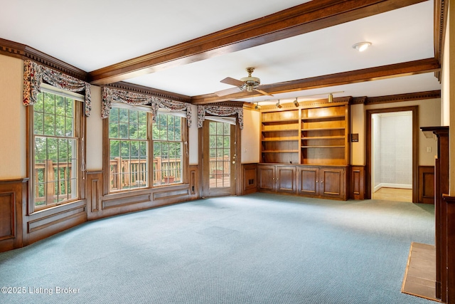 602 Club Ln, Louisville, KY 40207 - carpeted spare room featuring a wainscoted wall, crown molding, a ceiling fan, and beam ceiling