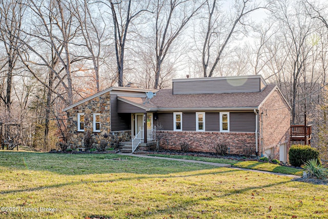 view of front of home with brick siding, a chimney, a front lawn, and roof with shingles