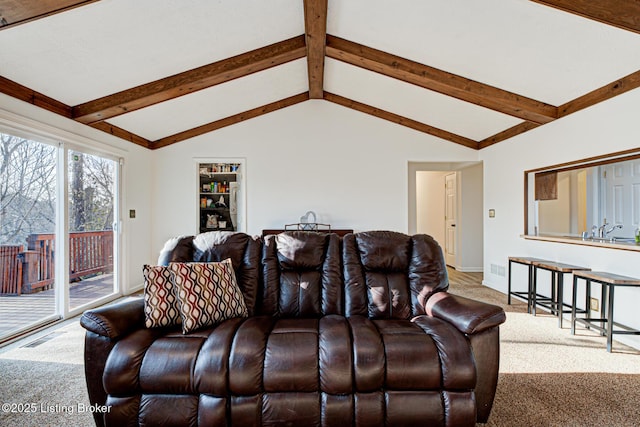 living area with vaulted ceiling with beams, baseboards, visible vents, and carpet floors