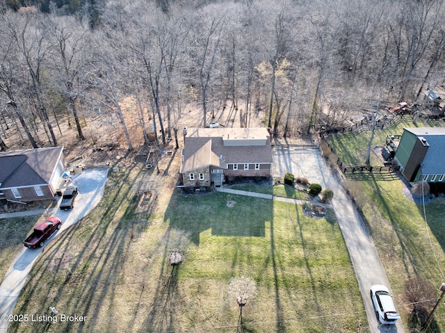 aerial view featuring a wooded view