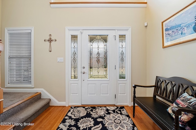 entrance foyer with baseboards and light wood-type flooring