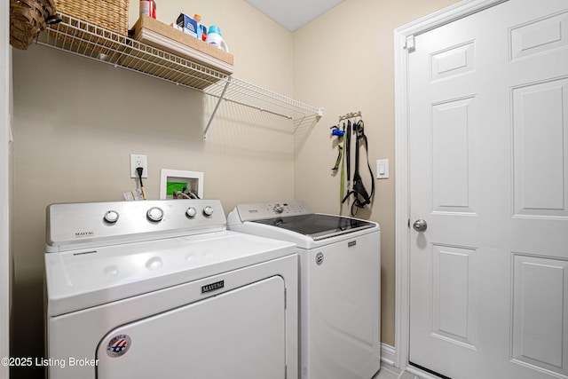 laundry area featuring laundry area and washer and clothes dryer