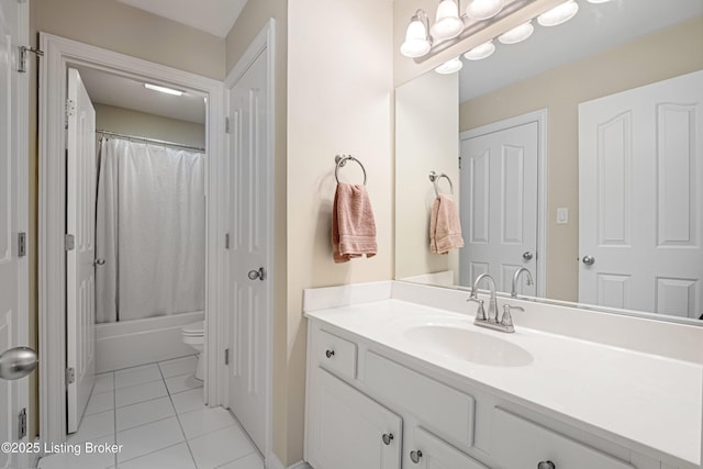 bathroom with tile patterned floors, toilet, vanity, and shower / bath combo