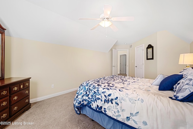 bedroom featuring visible vents, lofted ceiling, baseboards, light colored carpet, and ceiling fan