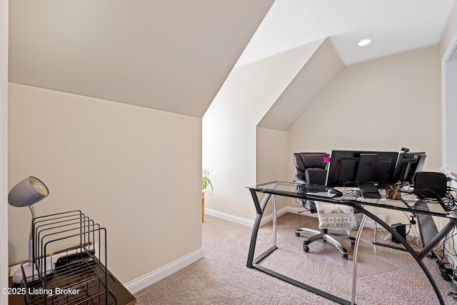 office area featuring baseboards, lofted ceiling, and carpet