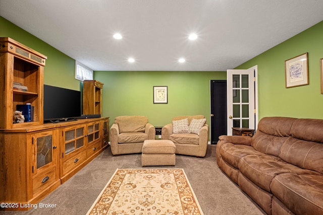 living room with recessed lighting and carpet