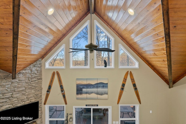 details featuring beam ceiling, wood ceiling, and ceiling fan