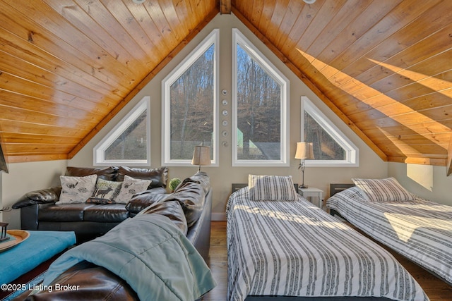 bedroom with vaulted ceiling, wood finished floors, and wooden ceiling